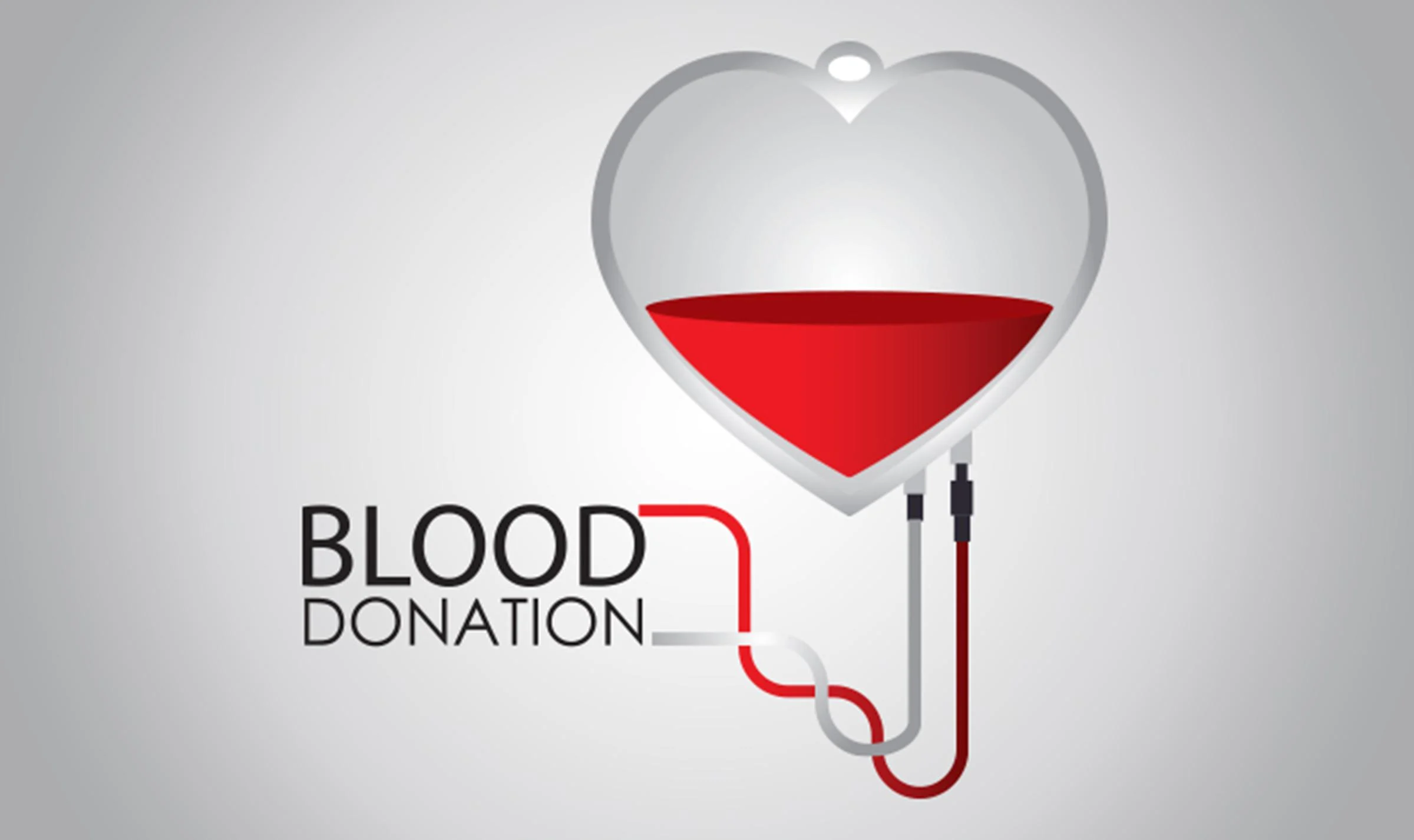 Happy blood donor donating blood
